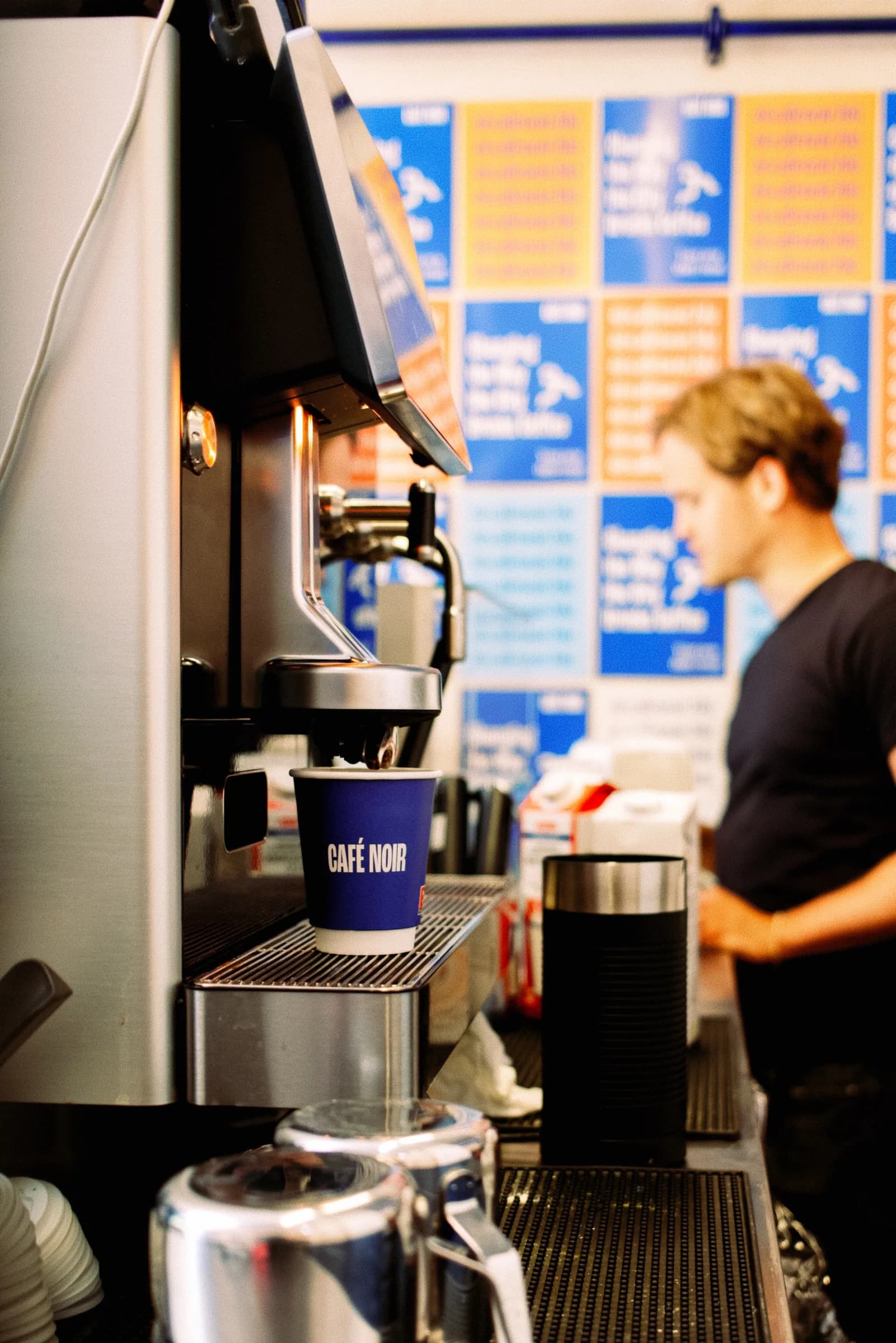 Café Noir staff preparing service behind the counter