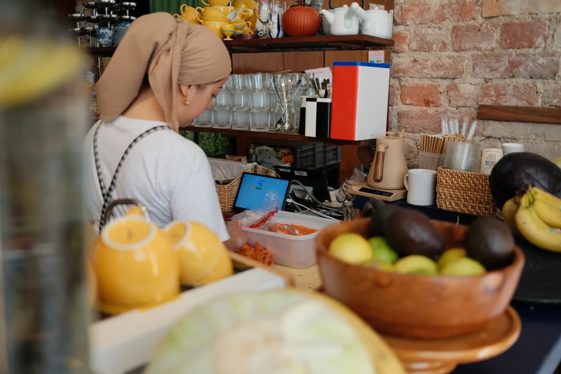 Café Tampopo staff preparing an order behind the counter