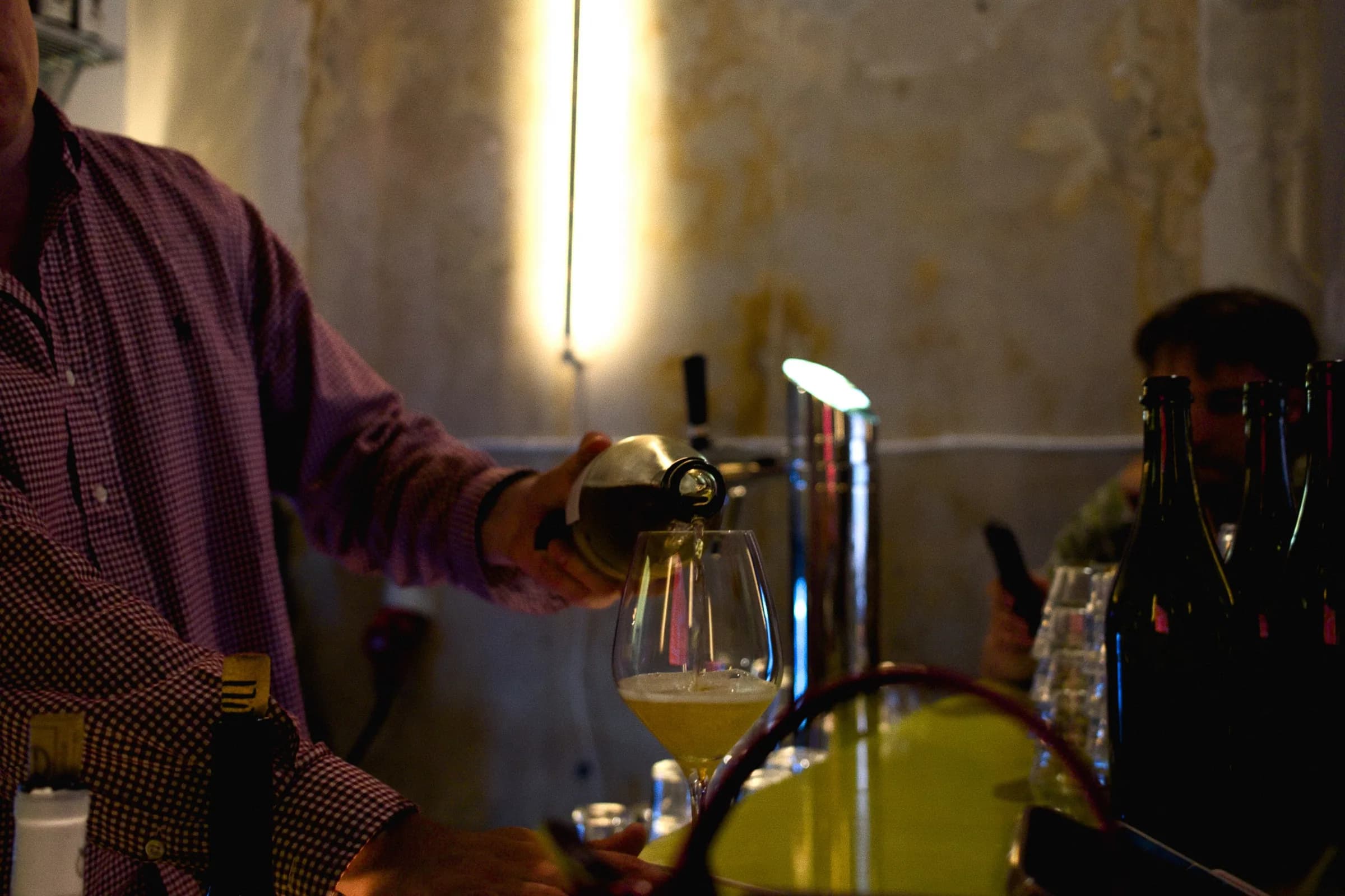 Gadeplan staff working behind the wine bar during service