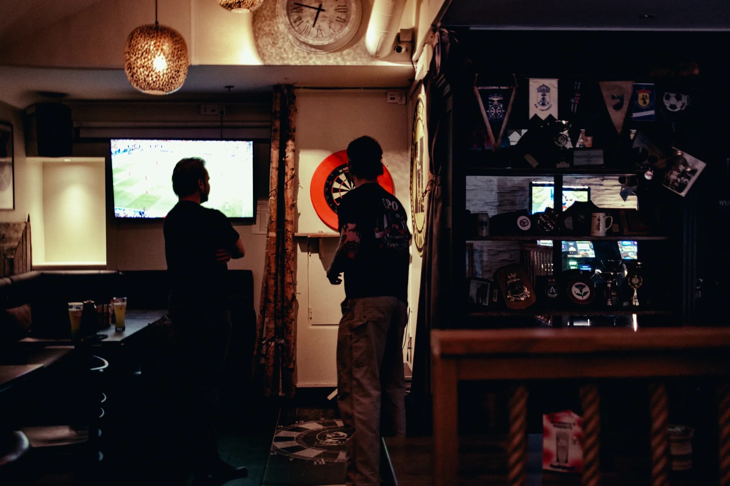 A dartboard and side room inside Pub Peräkammari