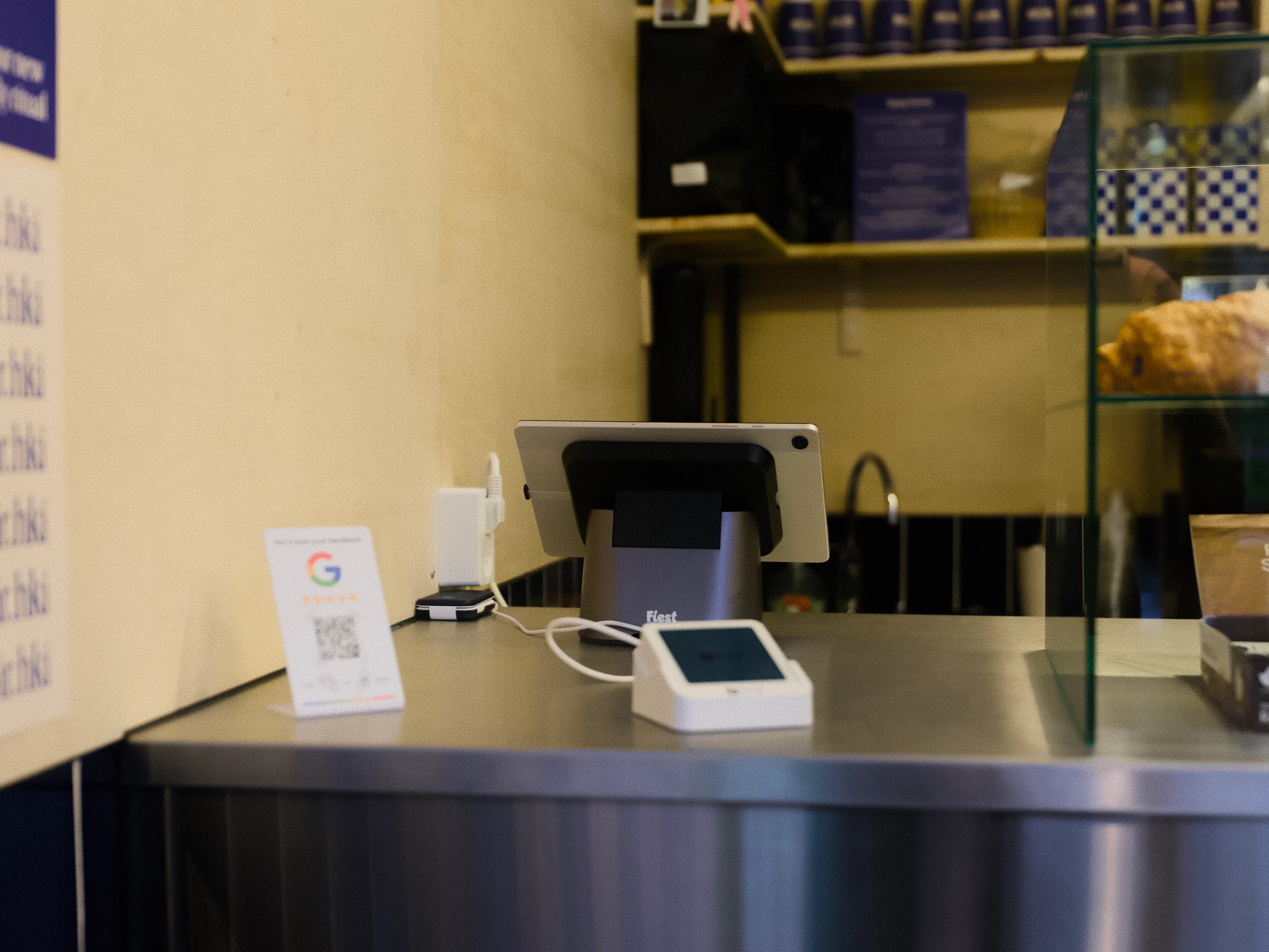 Fiest POS and payment terminal on a cafe counter